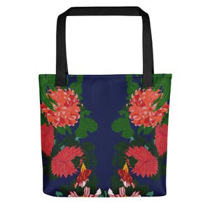May include: A navy blue tote bag with a floral pattern. The design features symmetrical arrangements of red and orange flowers with green leaves. The bag has black handles.