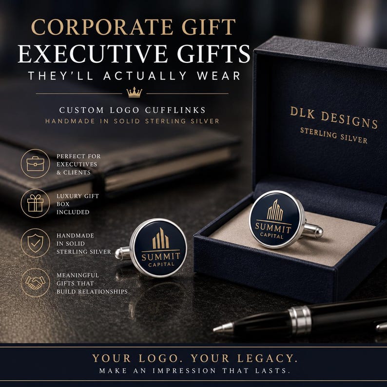 May include: A pair of round sterling silver cufflinks featuring a dark blue inlay with the gold-colored Summit Capital logo. One cufflink rests inside a navy blue presentation box labeled DLK Designs, while the other sits on a dark surface.
