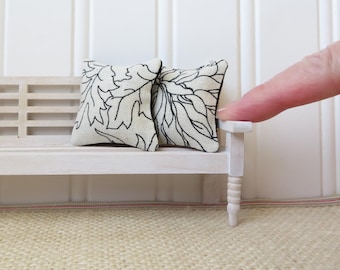 Dollhouse pillows in a Black and cream botanical pattern