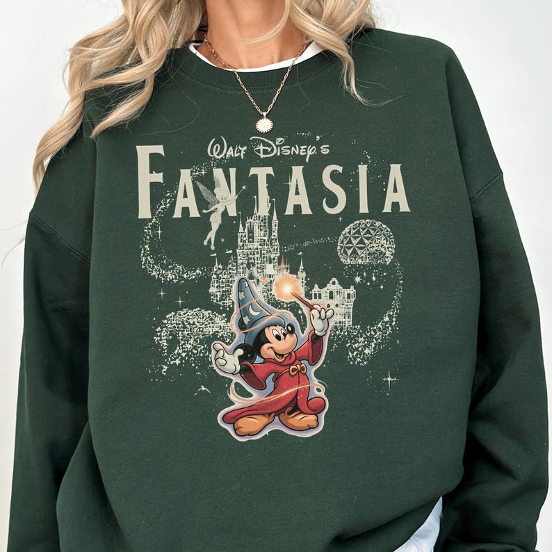A green sweatshirt with a Disney-themed graphic of Mickey Mouse and a castle, along with the text "Disney's Fantaasia".