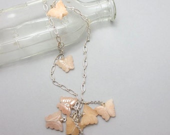 SALE. Peach Butterflies. Carved quartz butterflies clustered on long adjustable necklace