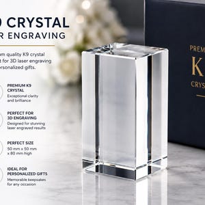 May include: A clear rectangular K9 crystal block for 3D laser engraving. The text on the image reads K9 CRYSTAL FOR ENGRAVING, PREMIUM K9 CRYSTAL, and 50 mm x 50 mm x 80 mm high. The crystal is transparent with sharp edges and a smooth surface.