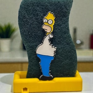 Soporte para esponjas con diseño de Homer Simpson: un accesorio de cocina original.