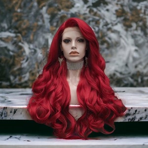 May include: A long, bright red wig with loose curls. The wig is styled in a side part and falls to the shoulders.