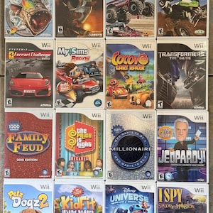 May include: A collection of Wii video game cases. Titles include "Rapala Tournament Fishing", "Family Feud", "Jeopardy!", and "Disney Universe". The cases feature colorful graphics and game titles.