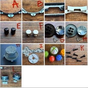May include: Assorted replacement parts for a gaming controller, including buttons, directional pads, and screws. The parts are in various colors, including black, gray, white, green, red, blue, and yellow. The parts are arranged on a wooden surface.