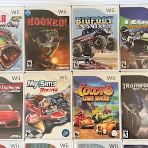 May include: A collection of Wii game cases. Titles include "Rapala Tournament Fishing", "Hooked! Real Motion Fishing", "Bigfoot Collision Course", "Kawasaki Quad Bikes", "Ferrari Challenge", "My Sims Racing", "Cocoto Kart Racer", and "Transformers: The Game".