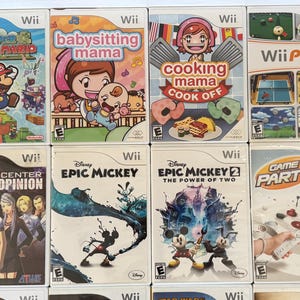 May include: A collection of Wii game cases, featuring titles like "Super Paper Mario," "Babysitting Mama," "Cooking Mama Cook Off," and "Wii Play." Other games include "Trauma Center: Second Opinion," and "Epic Mickey."