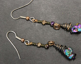 Iridescent titanium nuggets with copper wrapping... Earrings for your darker side.  Hand made in our Michigan studio.