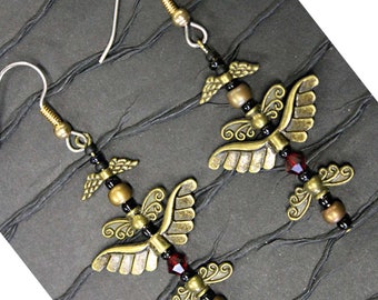 The Happy Spirit dancing Earrings.  Red Swarovski Crystals and bronze wings.