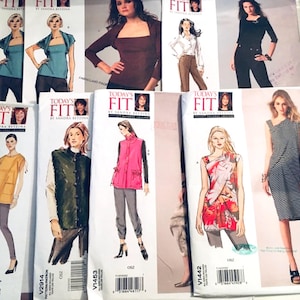 May include: A collection of sewing patterns for women's clothing. The patterns feature a variety of styles, including tops, dresses, and trousers. The patterns are printed on white paper with black and white illustrations.