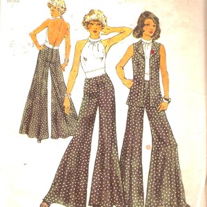 May include: A vintage Simplicity sewing pattern for a women's pantsuit. The pattern shows three women wearing different variations of the pantsuit, all with wide-legged trousers and a polka dot print. The pattern number is 5611 and the size is 10, with a bust of 32 1/2 inches and a waist of 25 inches.