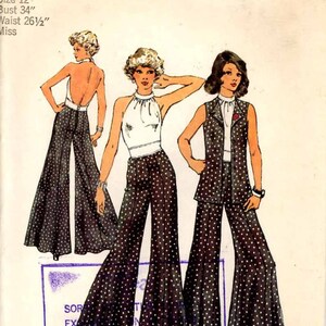 May include: A vintage sewing pattern for a women's pantsuit with a halter top and a vest. The pattern is for size 12, bust 34 inches, and waist 26 1/2 inches. The pattern is from Simplicity and is number 5611.