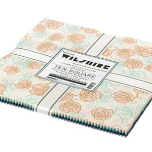 May include: A stack of Wilshire Ten-Square fabric squares. Each square measures 10" x 10". The fabric features a floral pattern with pink and teal roses on a cream background. The squares are bound with a white band and a label.