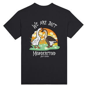 May include: Black t-shirt with a graphic of two geese with the text "We are just misunderstood" and "Anxty Designs" printed on the back.