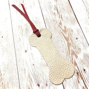 Marcapáginas de cuero con forma de hueso de perro hecho a mano con borla roja, regalo para amantes de los libros