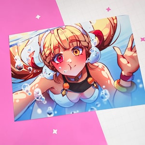 May include: A colorful anime-style illustration of a person underwater, surrounded by bubbles. The character has blonde hair, a red and yellow eye, and is wearing a white and black outfit. The image is on a pink and white surface with the text "Handmade with love".