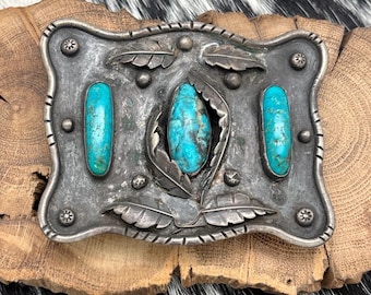 Fibbia per cintura Navajo degli anni '50 in argento sterling e turchese con foglie e gocce di pioggia.