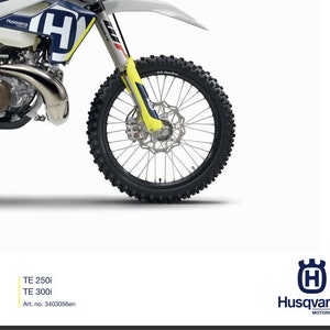 May include: A white and blue Husqvarna motorcycle with yellow accents. The motorcycle is a dirt bike with a large front wheel. The text "REPAIR MANUAL 2018" is at the top of the image. The text "TE 250i TE 300i Art. no. 944000000000" is at the bottom of the image.