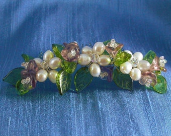 Bridal comb with pearl flowers, purple glass flowers and green leaves