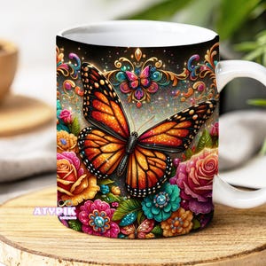 May include: White ceramic mug featuring a vibrant butterfly design with orange and black wings, surrounded by colorful flowers and decorative elements. The mug has a white handle and the text "ATYPIK DESIGNS" at the bottom.