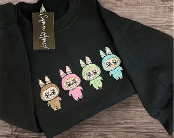 Monster Doll Embroidered Sweatshirt – Cute Creepy Graphic Gildan Crewneck, Trendy Y2K Horror-Inspired Streetwear Pullover