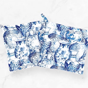 May include: Blue and white porcelain vases with floral designs. The vases are arranged in a random pattern, creating a visually appealing design.