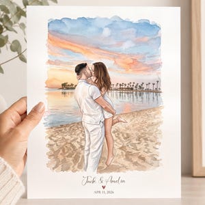 Könnte beinhalten: Ein Aquarelldruck auf weißem Papier, der ein sich küssendes Paar an einem Strand bei Sonnenuntergang zeigt. Die Illustration zeigt eine Person in weißer Kleidung, die eine andere Person hält. Darunter steht Jack & Amelia, ein Herz und APR 11, 2026.