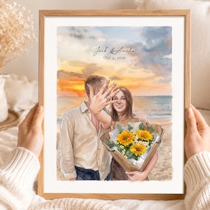 May include: A framed watercolour print depicting a couple on a beach at sunset. The person on the left wears a light shirt, while the person on the right holds a bouquet of yellow sunflowers. The text Jack & Amelia and Oct 4, 2026 is visible.