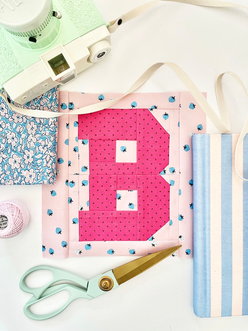 Alphabet quilt block with a pink letter B