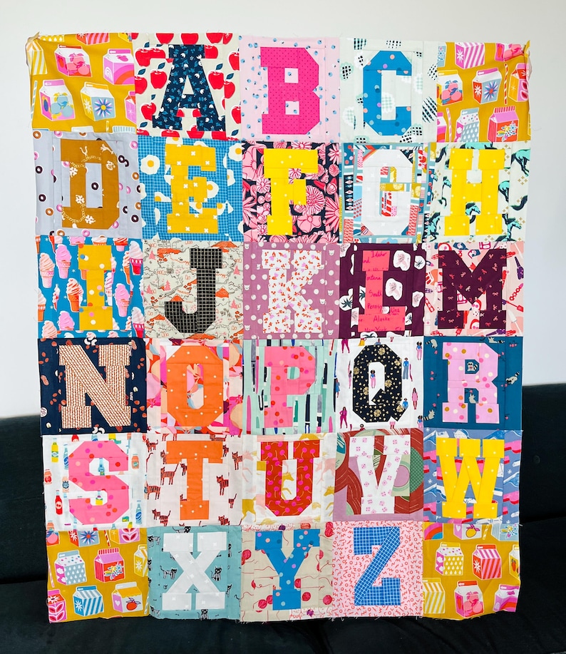 Maxinalist alphabet quilt in bright colors in. varsity letter style