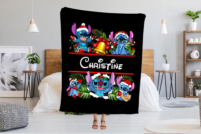 May include: Black blanket featuring Stitch characters in Santa hats and festive decorations. The blanket has the name "Christine" in white script. Stitch is depicted in various poses, holding candy canes and Christmas lights.