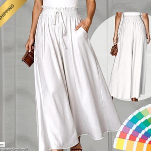 May include: White palazzo pants with a drawstring waist and pockets. The wide-leg pants are made of a flowing fabric and are shown with a brown clutch. A smaller image of the pants is in the background.