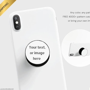May include: White phone case with a black and white pop-up grip. The grip has a circular design with the text "Your text, or image here." The image also includes the text "Any color, any pattern FREE 4000+ pattern catalog, or bring your own image."