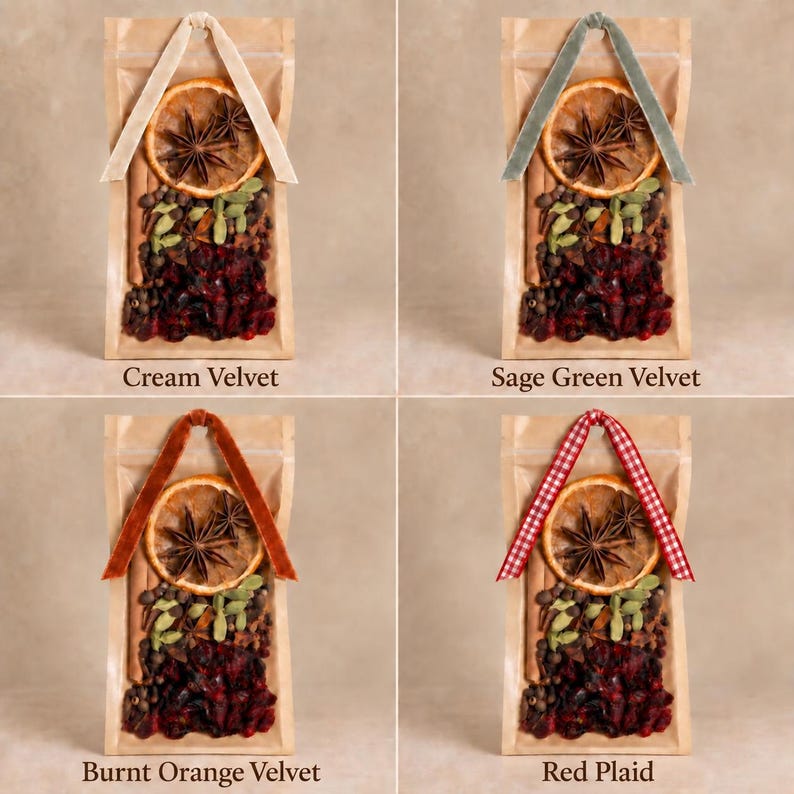 May include: Four clear pouches containing dried orange slices, star anise, cinnamon sticks, green cardamom pods, and dark red berries. Each pouch features a decorative ribbon loop in cream velvet, sage green velvet, burnt orange velvet, or red plaid.