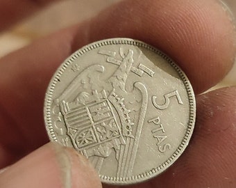 Monedas de 5 pesetas de 1957 estrella 65
