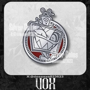 May include: A silver-colored VOX pin with a cartoon face design. The pin features a red and white color scheme with the text "VOX" at the bottom and the social media handle "X:@deeeeeee823623".