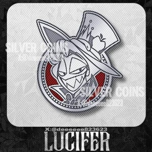 May include: A silver and red Lucifer character design. The image features a detailed illustration of a character wearing a top hat with an apple, set within a circular frame. Text includes "SILVER COINS" and "LUCIFER".