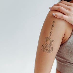 Floral Guitar Temporary Tattoo - Harmonize Your Style with Nature&#39;s Melody |  Easy to Apply, Perfect for Music Lovers & Festival-Goers