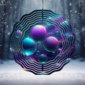 May include: A metal wind spinner with a circular design featuring multiple iridescent bubbles in shades of purple, blue, and green. The spinner is suspended from a silver chain.