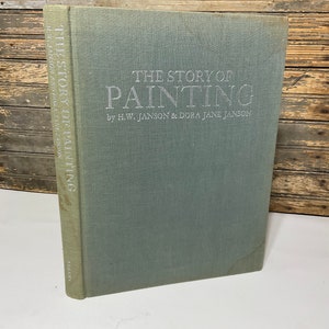 May include: A hardcover book titled "THE STORY OF PAINTING" by H.W. JANSON & DORA JANE JANSON. The book has a light blue-green cover with the title and author's names in silver lettering. The spine also has the title printed vertically.