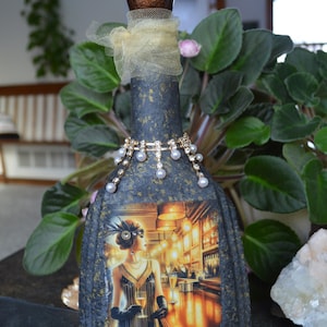 May include: A set of three ceramic mugs with a speckled, matte finish. The mugs are in shades of cream, light gray, and dark gray. Each mug has a simple, minimalist design and a rounded handle.