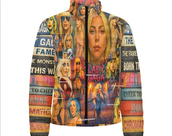 May include: A colorful, hooded jacket featuring a collage of images of Lady Gaga. The jacket is covered in portraits, album art, and text, including "Lady Gaga", "Born This Way", and "Chromatica". The jacket has a black zipper and cuffs.