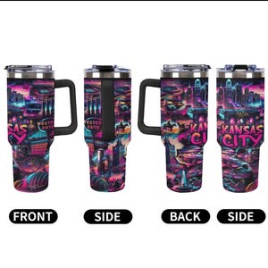 May include: Four stainless steel travel mugs with black handles and lids. Each mug features a vibrant, colorful design of Kansas City landmarks and the words "Kansas City" and "Western Auto". The mugs are shown from different angles.
