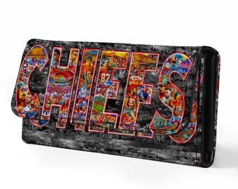 May include: Black wallet with the word "CHIEFS" in large, colorful letters. The letters are filled with images of football players and fans. The background is a grayscale cityscape.