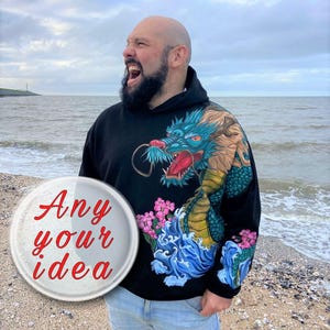 May include: A black hoodie with a blue and green dragon graphic on the front and sleeve. The dragon is surrounded by pink flowers and blue waves. The text "Any your idea" is on a white circle.