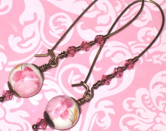 Pink Swarovski Crystal and White Ceramic Bead with Pink Flowers on Antique Brass Elongated Kidney Earrwires