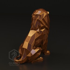 May include: A low-poly style sculpture of a lion, rendered in a gold colour. The lion is sitting with its head turned to the side, and its tail is curled around its legs.