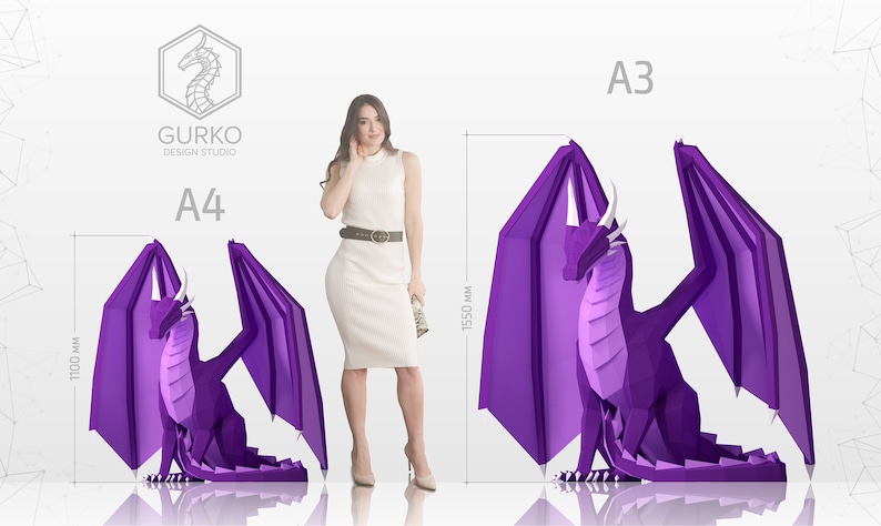 May include: Two purple origami dragon papercraft models in different sizes. The larger dragon is labeled "A3" and measures 15.50 inches tall. The smaller dragon is labeled "A4" and measures 11.00 inches tall. The text "GURKO DESIGN STUDIO" is visible in the top left corner.