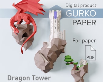 May include: A papercraft scene featuring a red dragon perched on a brown rock formation, a white tower, and a small island with a tree and buildings. The text "Dragon Tower" and "GURKO PAPER" are also visible.